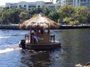 Tiki Hut with outboard - seen on New River
